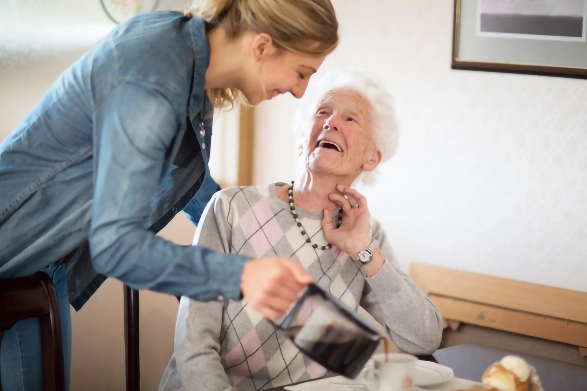 Image of clinical staff with a elderly lady