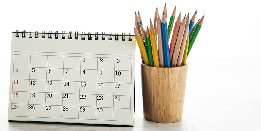 Image of a calendar and pencils